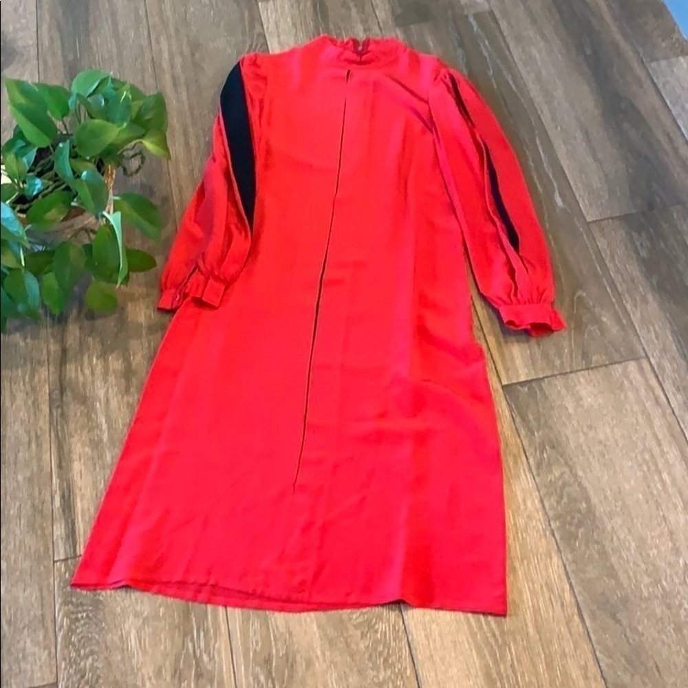 100% silk red dress size 10 vintage circa 1980
Black insets on balloon sleeves